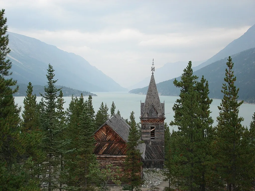 Wooden church among trees with lake and mountains Keywords: chilkoot trail; canada