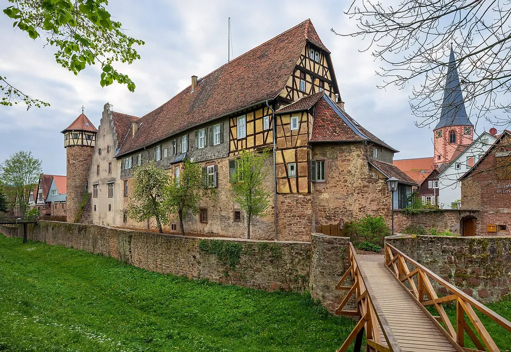 Michelstadt, Germany: the buildings of the former Michelstadt castle (also known as Kellerei, i.e. wine cellars), seen from south-east over the castle moat.