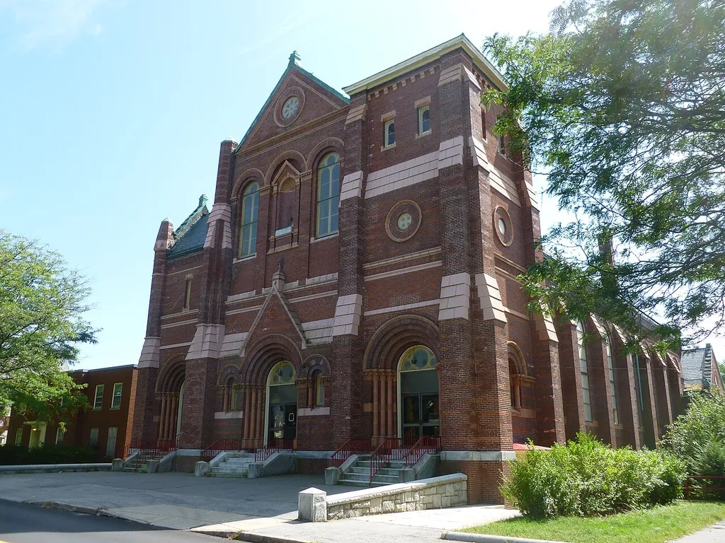 The former Sacred Heart Church, located near 177 Moore Street, Lowell, Massachusetts. North (front) and west sides of building shown.