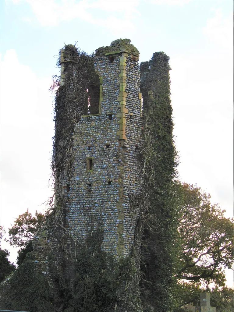 The ruined bell tower of Saint Margaret's church in the churyard of Saint Mary's parish church which is located in the village of Antingham, Norfolk, England.
