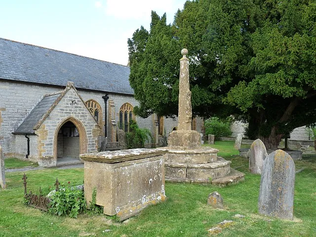 Churchyard and cross, Drayton The cross dates from the 15th century and was recut in the 17th century. St Michael fighting the dragon is depicted on the shaft.