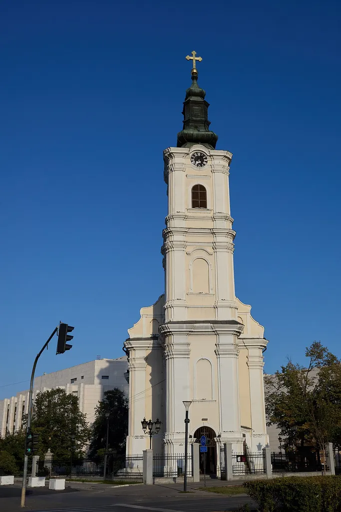 The Church of the Assumption of the Holy Mother of God, commonly known as the Uspenska Church, is a Serbian Orthodox church situated in the heart of Novi Sad, Serbia. Located on Uspenska Street, adjacent to the Serbian National Theatre, it stands as one of the city's most significant religious and cultural landmarks. Constructed between 1765 and 1774, the church exemplifies Baroque architecture with its single-nave design, semi-circular altar apse, and a prominent bell tower. The iconostasis was intricately carved by the Marković brothers, Aksentije and Arsenije, while the icons were painted by renowned artists including Janko Halkozović, Dimitrije Janković, and Andrej Šaltista. Recognized as a cultural monument of great importance, the Uspenska Church remains an active place of worship and a testament to the rich Orthodox heritage of Novi Sad.