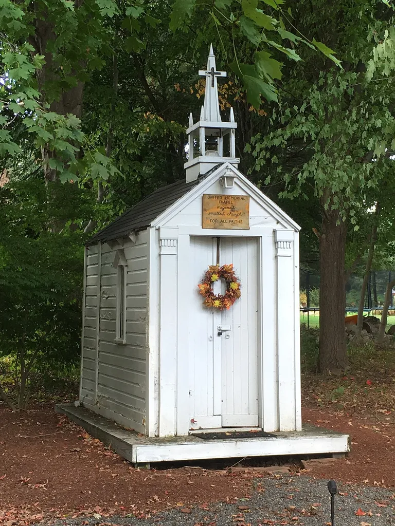 Union Church of All Faiths in Hudson, Massachusetts, USA. Photographed September 24, 2019, from Causeway Street. This is a small chapel originally built by Rev. Louis W. West, a retired minister, in the 1950s. During most of that time it was located in Hudson, MA, although for a few years in the mid-2000s it was located in Nantucket, MA. It is now located on private property on Causeway Street.