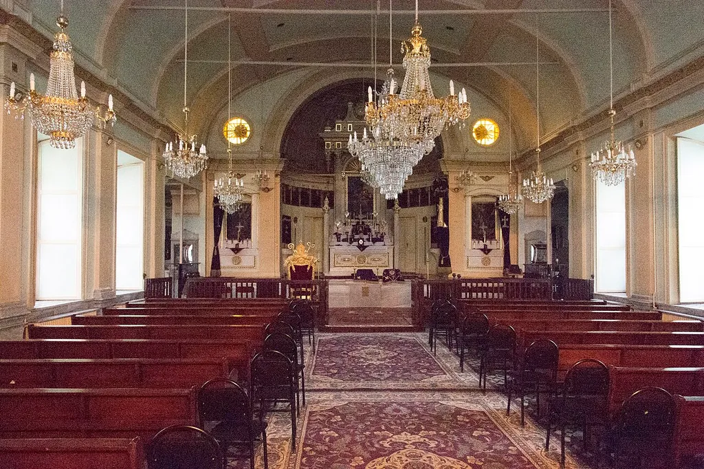 St. John’s Church. This church was originally built of timber in Sarayiçi, Gedikpaşa and inaugurated by Patriarch Stephen Zakarian III on 6 December 1827. On 18 December 1849 it burned down. On 13 June 1871 Sultan Abdülaziz gave permission for its reconstruction and on 27 June 1876 a new church was opened. It was later repaired and re-opened on 26 March 1895. It later fell into disrepair, was repaired, but suffered from another fire. Two repairs later we are in 1986 with a retiled, repainted and replastered church, reopened by Patriarch Shnork Kalusdian in a magnificent ceremony. A problem with this church is that it is in Gedikpasha, a neighbourhood that has two Armenian churches, a Protestant Evangelical) one and one Orthodox / Apostolical. I had great trouble keeping the two apart, in particular because other people mixed them up. This one is also called Gedikpaşa Surp Hovhannes Yegeğetsi, is part of the Orthodox church and its address is Fatih, Şehsuvar Bey Mah., Sarayiçi Sokak 3.