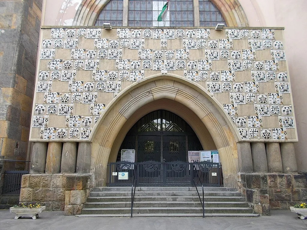 Fasori Reformed church. Architect: Aladár Árkay. Built: 1911–13. Folk Art Nouveau? style. Its facade decorated with Zsolnay ceramic tiles. Plaques on facade: The people of the Netherlands/provided unforgettable help/after the First and Second World Wars/to the thousands of starving Hungarian children/and refugees//In gratitude Budapest Capital/the Városliget Alle named after Queen Vilma.//The kindergarten of the Reformed Church opened with Dutch support/was named Julianna School in 1926./This school/after a 44-year forced hiatus/reopened as a church institution from September 1992.//Our gratitude to the people of the Netherlands and their two noble / rulers / is proclaimed by this plaque / from generation to generation.//Budapest Municipality of Erzsébetváros and Terézváros/Reformed Church of Fasor//1992 - 7 Városligeti fasor, 7th district of Budapest.