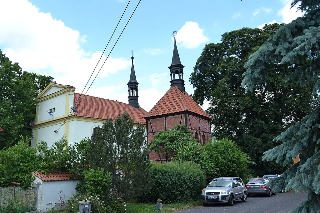Church of the Assumption and a bell tower in Církvice, Ústí nad Labem, Czech Republic.