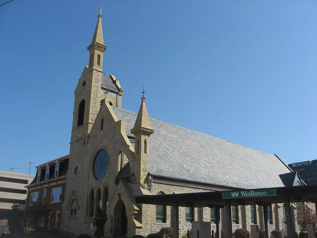 Front and western side of Trinity Episcopal Church, located at 424 Juliana Street (West Virginia Route 68) in Parkersburg, West Virginia, United States. Built in 1878, it is listed on the National Register of Historic Places. Note the parish rectory in the background, built in 1863 and also listed on the National Register.