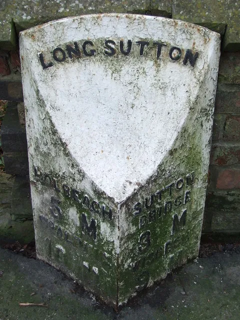 Milepost, London Road, outside churchyard