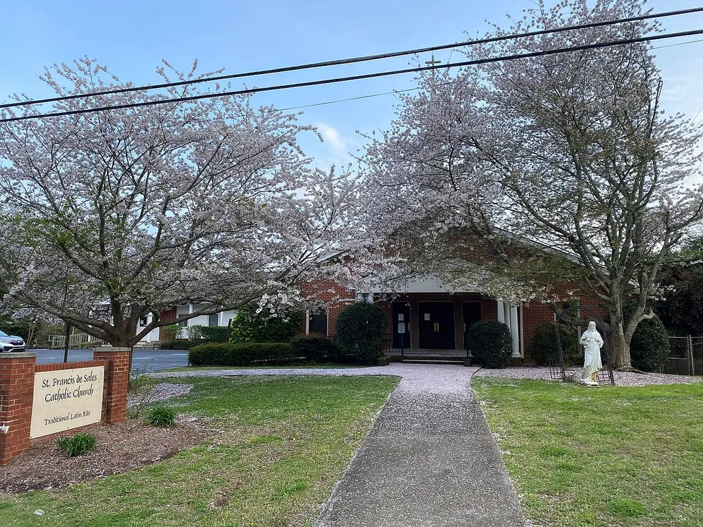 This image shows the façade of St. Francis de Sales Catholic Church in Mableton, GA during Spring.
