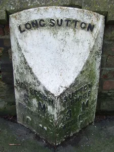 Milepost, London Road, outside churchyard