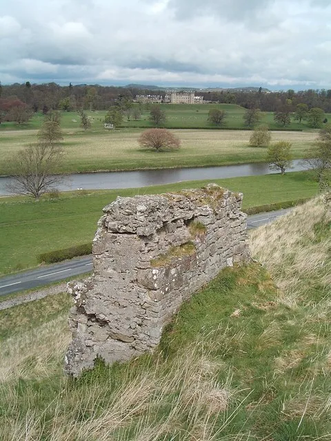Castles old and new. High on its earthworks on a narrow isthmus between the Tweed and Teviot rivers, Roxburgh Castle (foreground) had strong claims in medieval times to impregnability. Not so! The castle changed hands between the Scots and English no fewer than 10 times in the border wars of the 15th and 16th centuries. Now only a few walls remain of this sometime seat of the Scottish king David 1. Across the Tweed lies elegant, Georgian, Floors Castle, seat of the Innes Kers, Dukes of Roxburghe.