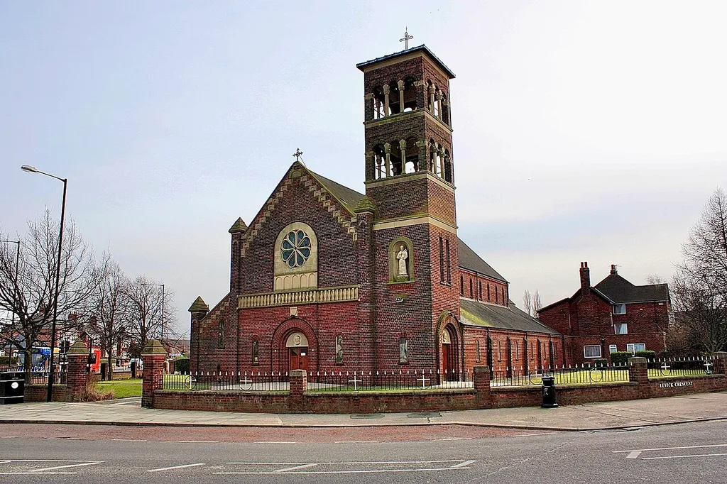 Roman Catholic church of St Francis of Assisi, Whinney Banks, Middlesbrough, North Yorkshire, seen from the north. The church is at the junction of the A1130 (on the right) and A1032 (on the left) roads.