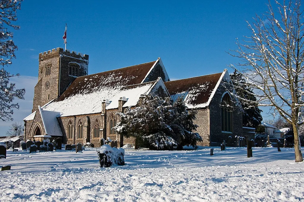 St Mary's parish church, Thatcham, Berkshire, seen from the southeast in snow