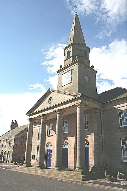Bellie Kirk. The classical columns of the portico on the north facade of Bellie Parish Kirk are only in the sunshine early on summer mornings.
