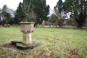 Font In Churchyard