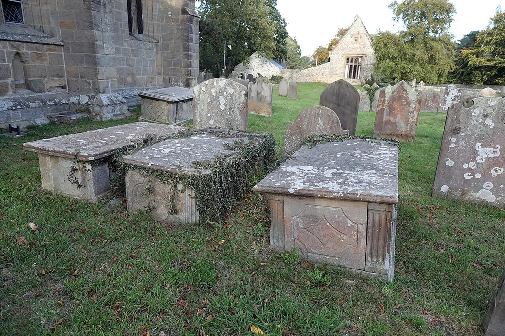 Group Of 3 Carter chest tombs approximately 3 metres south of priest's door of church of St Patrick, Patrick Brompton, North Yorkshire