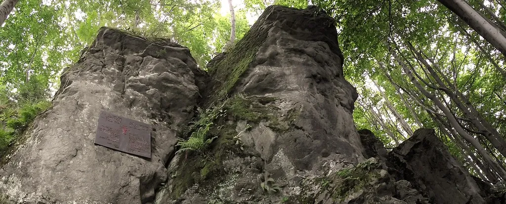 "The forest church" - a secret Lutheran service place used in the time of the Counter-Reformation at the place called Zakamiyń ("Behind the Stone") in Nýdek on the west side of Czantoria Mount. On the rock the plaque commemorating George Tranoscius.