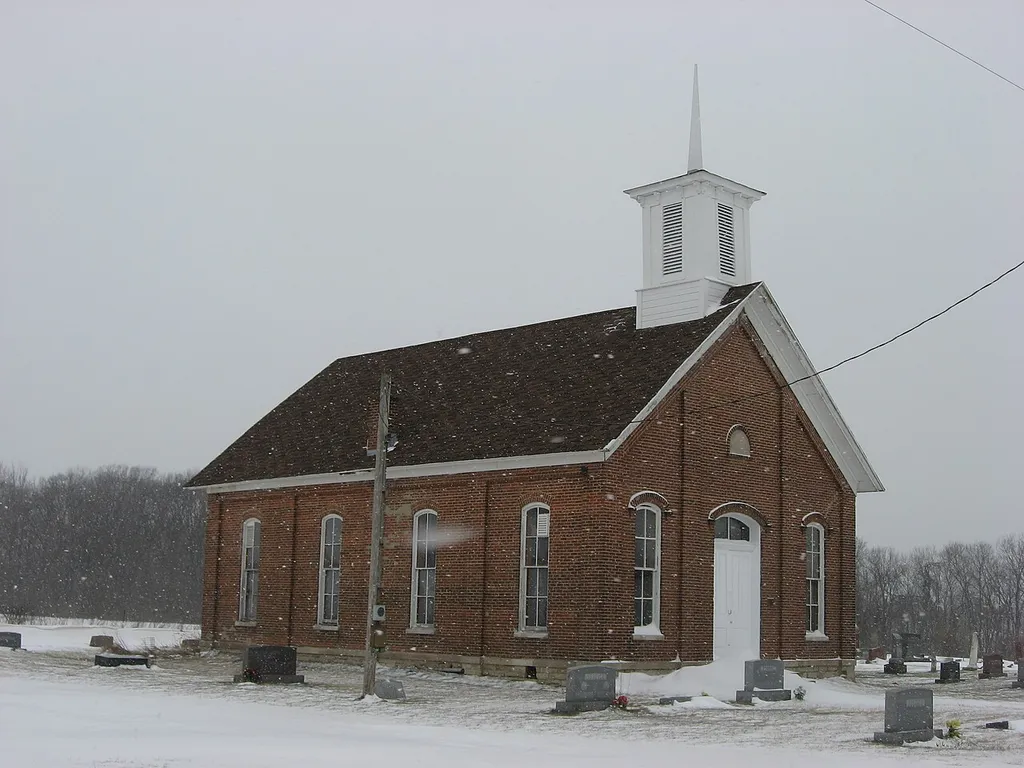 Front and southern side of the Pleasant Hill Church, located along the western side of County Road 675W north of its junction with County Road 400S west of Logansport in Clinton Township, Cass County, Indiana, United States. Built in 1875, it is listed on the National Register of Historic Places.