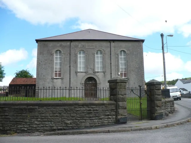 Penuel Baptist Chapel, Rhymney The plaque above the centre windows says - PENUEL / BAPTIST CHAPEL / 1838 REBUILT 1859