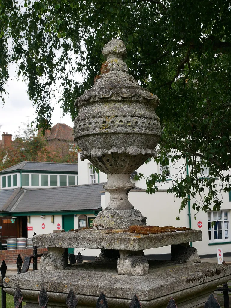 A Grade II listed early nineteenth-century grave monument, featuring a carved stone urn in Rochester, Kent. This is a photo of listed building number 1086516.