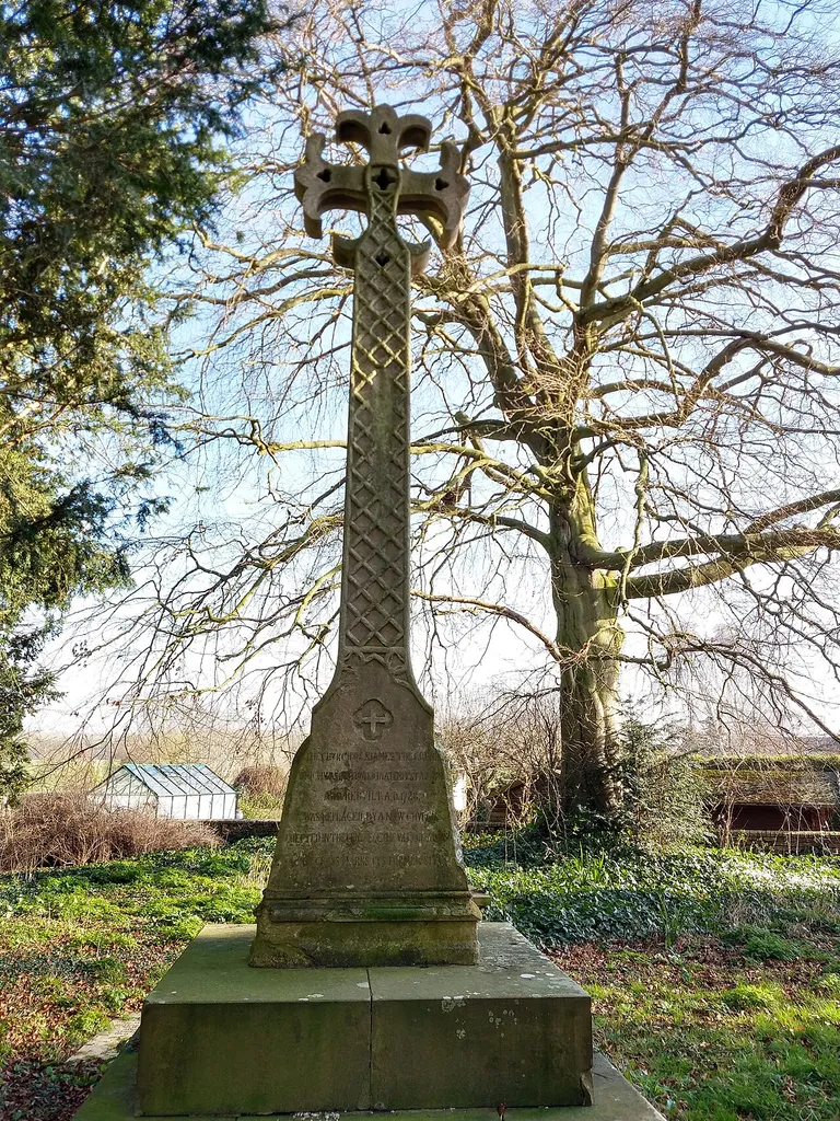 cross showing the location of the former Church of St James, in the Old Churchyard, Vicarage Road, Waresley, Huntingdonshire. Inscription reads "The Church of St James the Great, which was destroyed by a tempest AD 1724 and rebuilt AD 1728 was replaced by a new church erected in the centre of the village AD 1856. This cross marks its former site."
