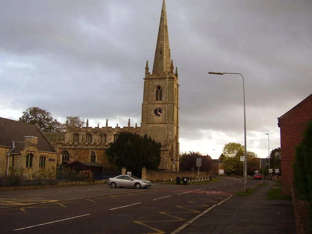 High Street, Great Gonerby, Lincolnshire. On the left are St Sebastian's parish church and the parish school.