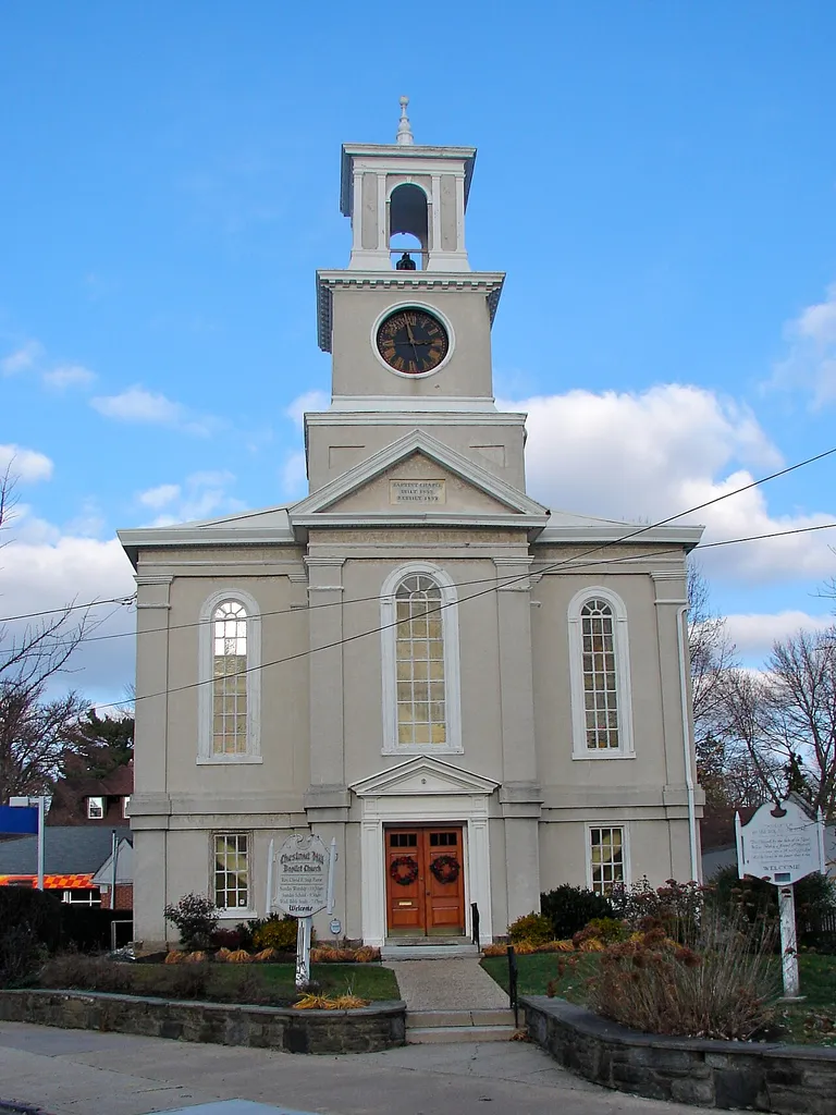 Chestnut Hill Baptist Church, 2 Bethlehem Pike, Chestnut Hill, Philadelphia, Pennsylvania. Picture taken from Germantown Ave. address equivalent to 8651 Germantown Ave. On front gable below steeple is written "BAPTIST CHAPEL BUILT 1835 REBUILT 1857" Coords 40.077242,-75.208046