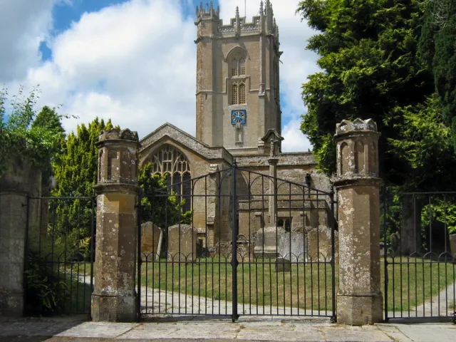 View through the east gate of the churchyard to St George's parish church, Hinton St George, Somerset