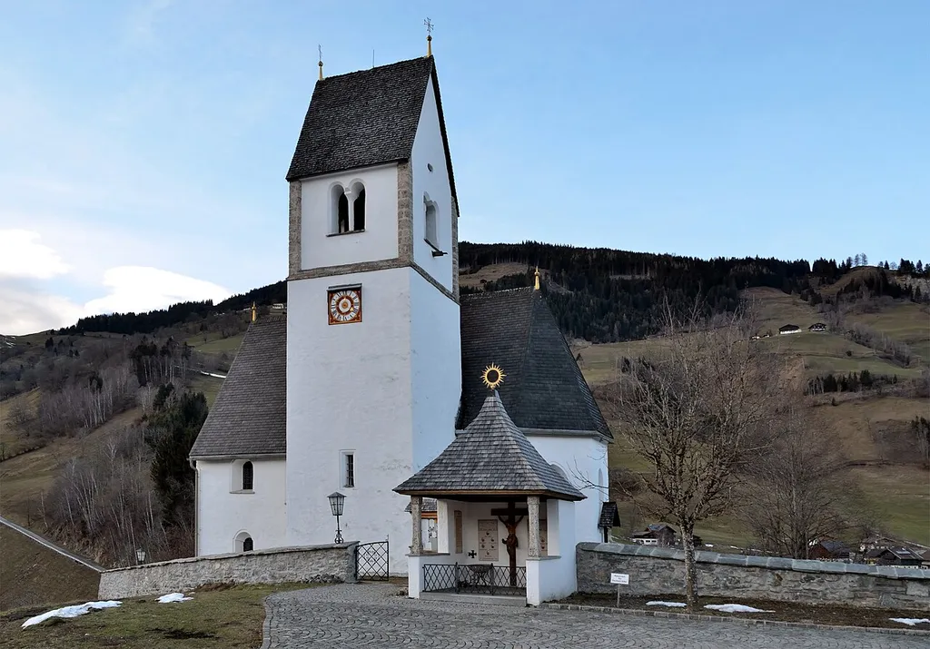 Catholic parish church of Eschenau, municipality of Taxenbach, Salzburg. South side with war memorial.