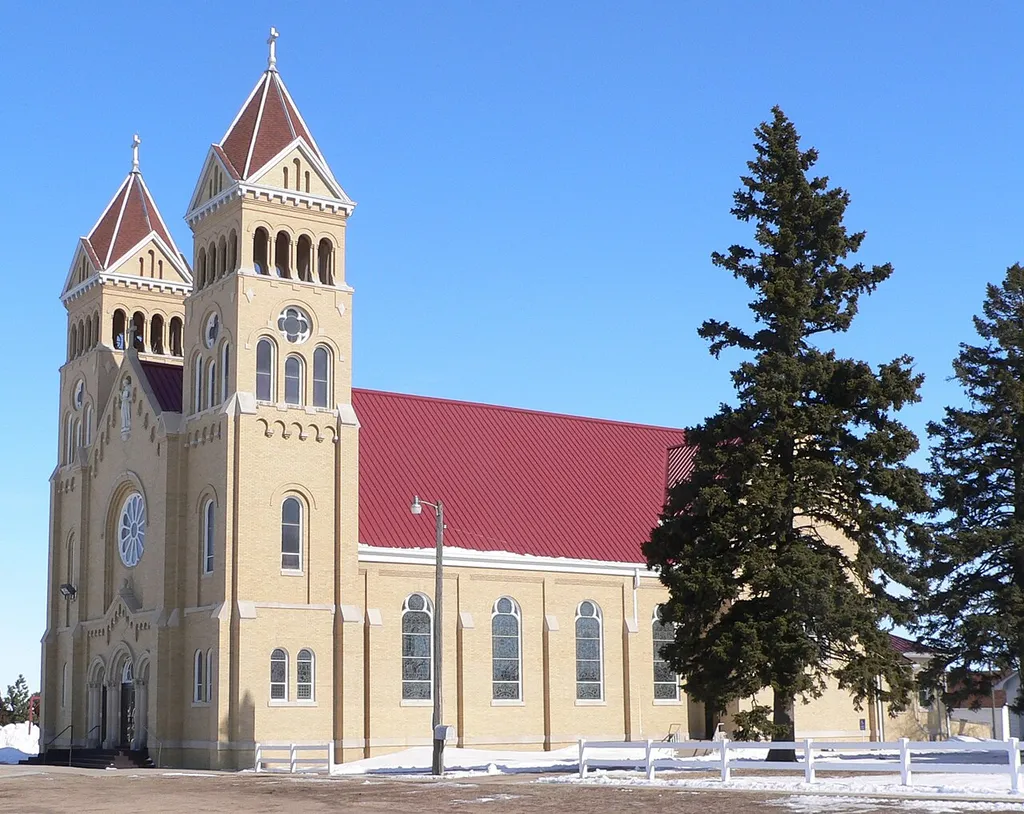 St. Bonaventure Church in Raeville, Nebraska; seen from the southwest. The church was designed by architect Jacob M. Nachitigal in Romanesque Revival style and built in 1917-19. It is part of the St. Bonaventure Church Complex, which is listed in the National Register of Historic Places.