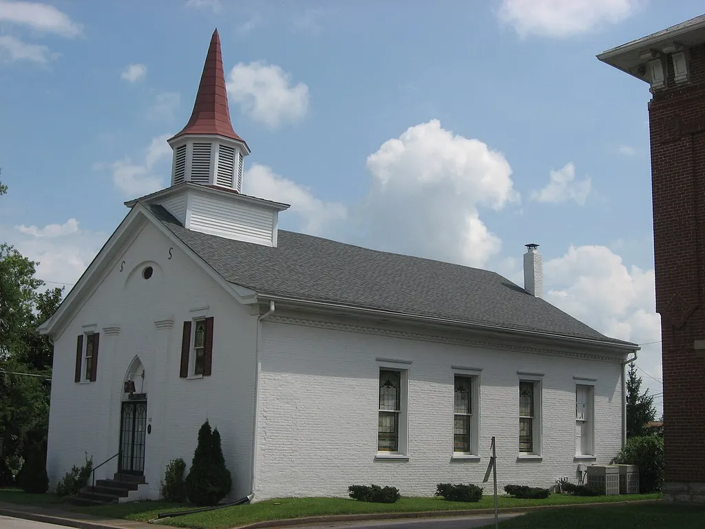 Front and western side of the former First Baptist Church, located at 112 W. Poplar Street in Elizabethtown, Kentucky, United States. Built in 1855, it is listed on the National Register of Historic Places.