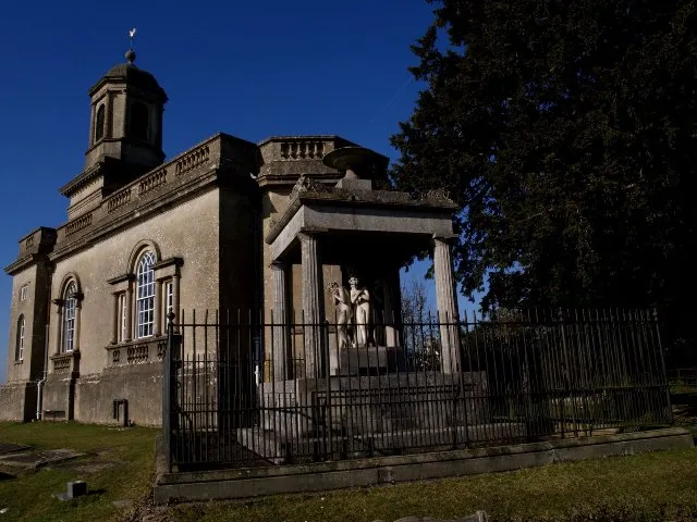 Tomb of 19th-century economist David Ricardo (foreground), next to St Nicholas' church, Hardenhuish, Wiltshire, seen from the east