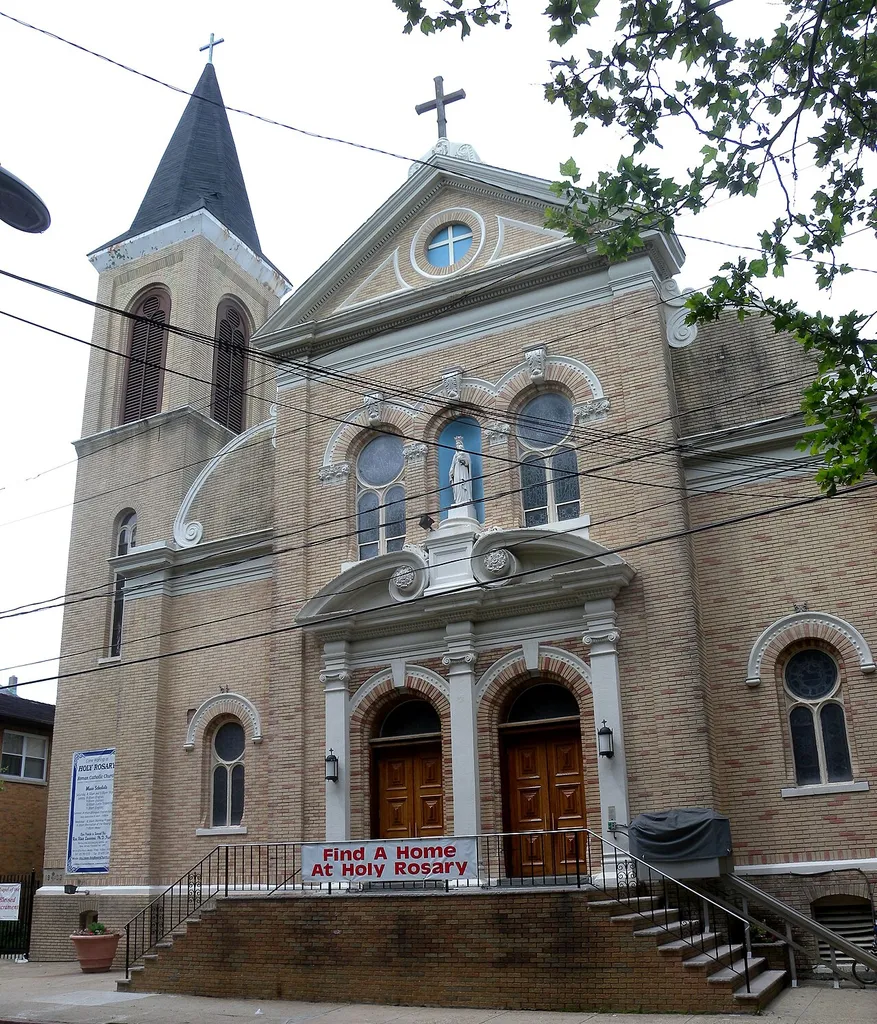 Looking northwest across 6th Street at Holy Rosary RC Church on a cloudy afternoon.