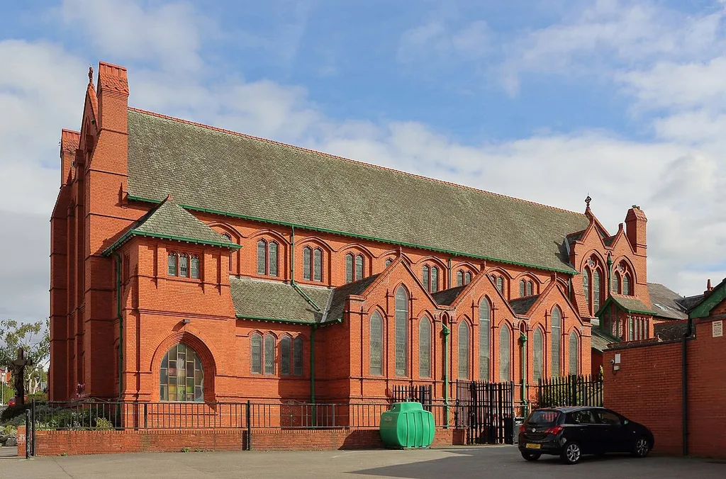 Grade II listed Roman Catholic church, 1899-1900, by Edmund Kirby of Liverpool. Ruabon brick with terracotta dressings; north side.
