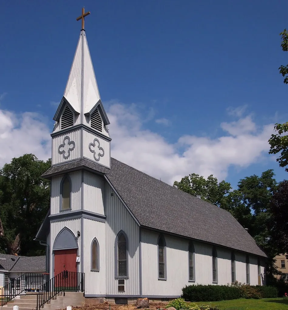 All Saints Church-Episcopal, Northfield, Minnesota, USA. Photo taken from the southwest standing on a stepstool, corrected for tilt distortion.