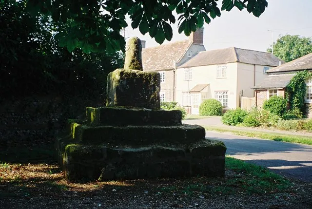 Pimperne: village cross The remains of the ancient cross at Pimperne, just outside the entrance to the churchyard.