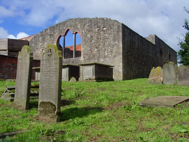 St Mary Magdalene and St Helena Church, Nunkeeling in the East Riding of Yorkshire, England.Looking southwest towards the ruin of St Mary Magdalene and St Helena Church. The church was given to the Benedictine priory founded here in 1150. After the dissolution, it remained the parish church but fell into disrepair. In 1810 the present structure was rebuilt using material from the old church. In the 20th century the church became disused and in about 1940 the roof and end gables were removed. The parish council stepped in to prevent its demolition in 1985 and now maintains it.