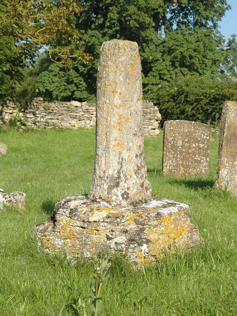 Base and broken shaft of Mediæval stone cross in St Michael's parish churchyard, Begbroke, Oxfordshire