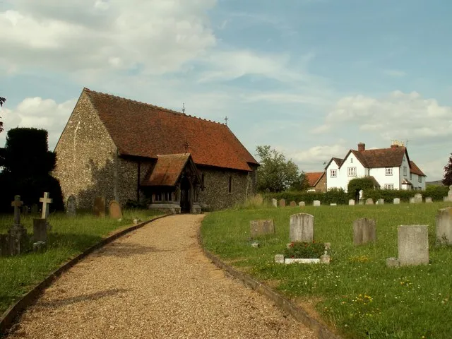 St. Mary the Virgin church, Little Laver, Essex. Apart from restoration in 1872, this is basically a Norman church. Inside is a good Norman font dated 1200. The manor house, at the right of the picture, belongs to the Little Laver Grange.
