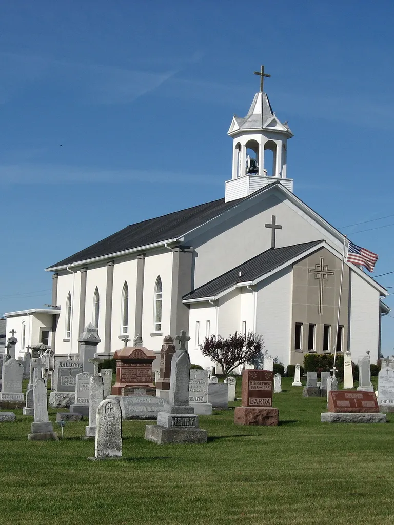 Front of Holy Family Catholic Church, located on the southern side of State Route 185 in Frenchtown, an unincorporated community in Wayne Township, Darke County, Ohio, United States. Built in 1866, the church was added to the National Register of Historic Places as a part of the Cross-Tipped Churches of Ohio Thematic Resources.