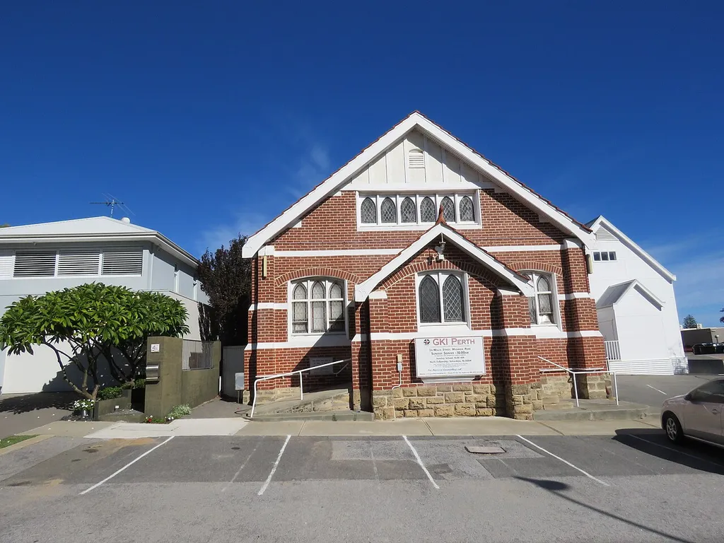 The heritage listed (Inherit # 25076) Mosman Park Uniting Church, Western Australia. The white building to the right is the Old Wesleyan Church.