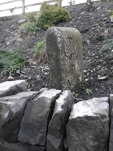 Milestone, ExYW Newsholme, just N of railway bridge