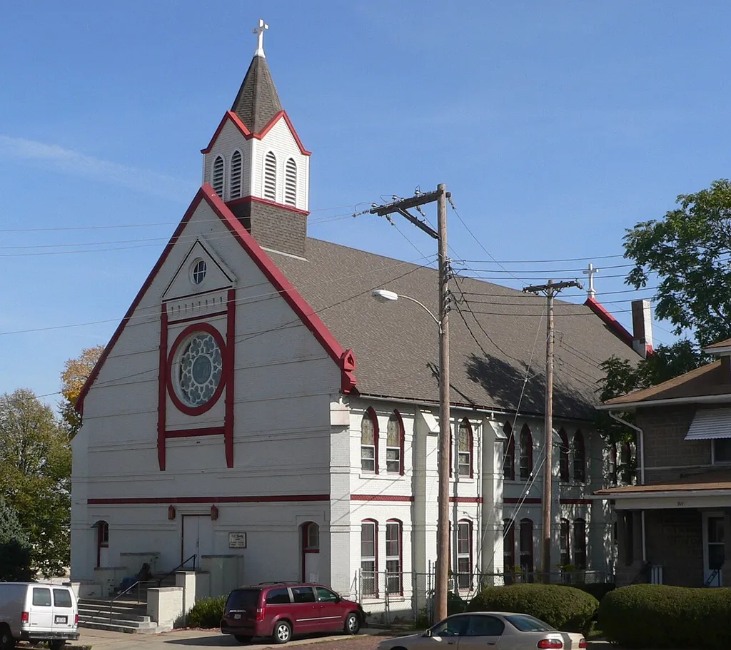Holy Family Catholic Church, located on the east side of 18th Street between Cuming and Izard Streets in Omaha, Nebraska; seen from the southwest.