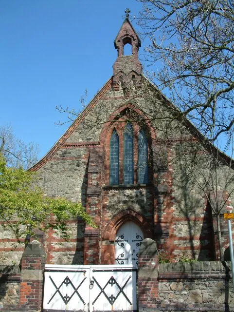 St Thomas the Apostle. The church of St Thomas the Apostle on Lumn Road. See the rear of the church and its graveyard 888857.