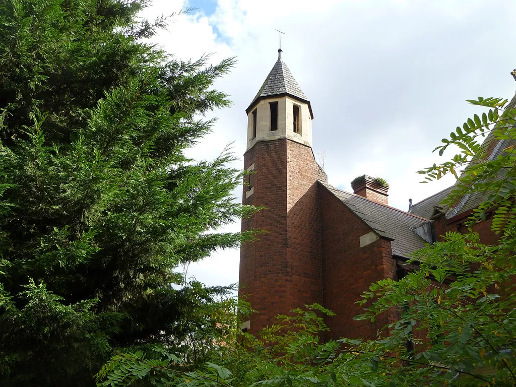St Olave, Woodberry Down, Stoke Newington, 1893 by Ewan Christian, stair-turret capped by stone conical roof.
