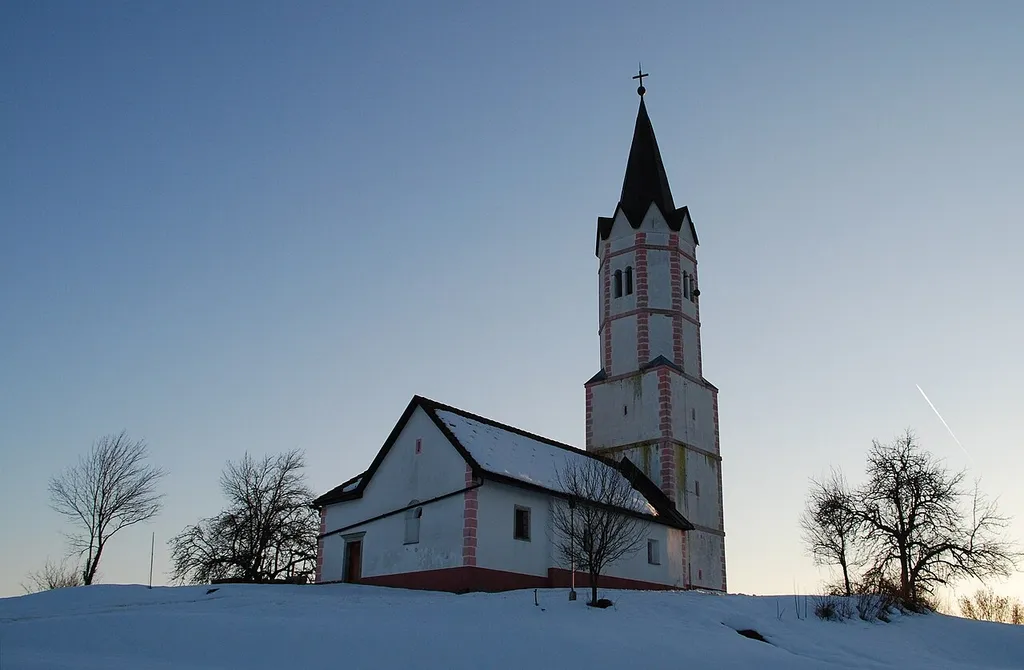 St. George's Church. Kaplja Vas, Municipality of Sevnica (Slovenia). Correctly oriented. The church tower was built in the 17th century (the nave is Romanesque, the presbyterium is Gothic).