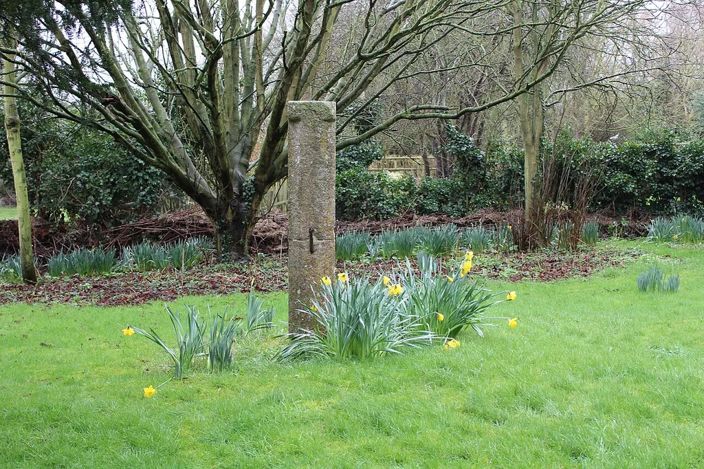 Shaft of late Medieval stone cross in St Swithin's parish churchyard, Long Bennington, Lincolnshire