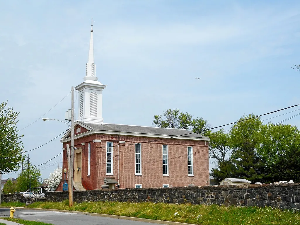 Bible Presbyterian Church in Marcus Hook, Pennsylvania. Above the main entrance is a date stone that says "St. Martin's Protestant Episcopal Church 1845." Church yard contains grave(s) of Revolutionary War veteran(s)