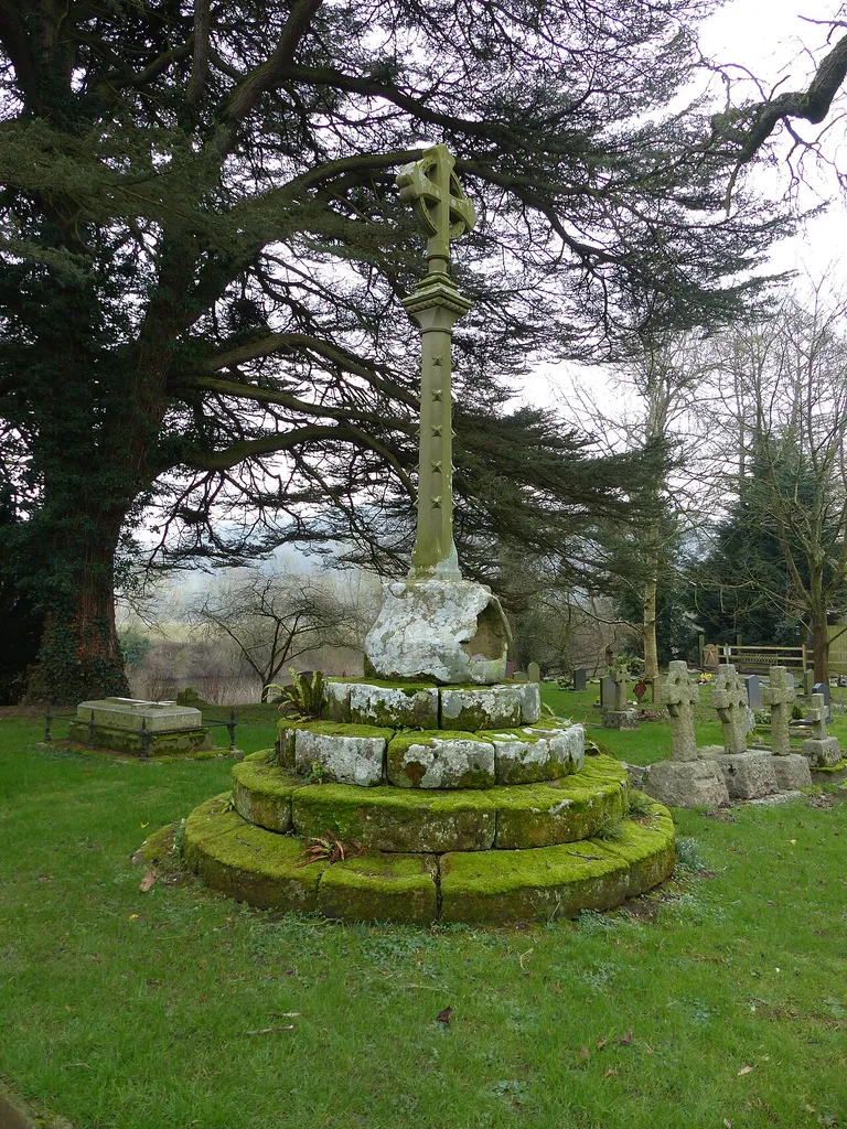 Churchyard cross in St Dubricius's churchyard: Grade II* listed building and scheduled monument Whitchurch, Herefordshire. .mw-parser-output .messagebox{margin:4px 0;width:auto;border-collapse:collapse;border:2px solid var(--border-color-progressive,#6485d1);background-color:var(--background-color-neutral-subtle,#fbfcff);color:var(--color-base,#202122);box-sizing:border-box;border-inline-start-width:8px}.mw-parser-output .messagebox.mbox-small{font-size:88%;line-height:1.25em}.mw-parser-output .mbox-warning,.mw-parser-output .mbox-speedy{border:2px solid var(--border-color-error,#b22222);background:var(--background-color-error-subtle,#ffdbdb);border-inline-start-width:8px}.mw-parser-output .mbox-serious,.mw-parser-output .mbox-delete,.mw-parser-output .mbox-stop{border:2px solid var(--border-color-error,#b22222);border-inline-start-width:8px}.mw-parser-output .mbox-issue,.mw-parser-output .mbox-content{border:2px solid #f28500;background:var(--background-color-warning-subtle,#ffe);border-inline-start-width:8px}.mw-parser-output .mbox-query,.mw-parser-output .mbox-style{border:2px solid #f4c430;background:var(--background-color-warning-subtle,#ffe);border-inline-start-width:8px}.mw-parser-output .mbox-shit{border:2px solid #960;border-inline-start-width:8px}.mw-parser-output .mbox-license{border:2px solid #88a;border-inline-start-width:initial}.mw-parser-output .mbox-legal{border:2px solid var(--border-color-notice,#666);background:var(--background-color-base,#fff);border-inline-start-width:8px}.mw-parser-output .mbox-honor{border:2px solid #ca3;background:var(--background-color-warning-subtle,#fcf4db);border-inline-start-width:8px}.mw-parser-output .mbox-growth{border:2px solid #8d4;background:var(--background-color-success-subtle,#d5fdf4);border-inline-start-width:8px}.mw-parser-output .mbox-move{border:2px solid #93c;border-inline-start-width:8px}.mw-parser-output .mbox-protection,.mw-parser-output .mbox-message{border:2px solid var(--border-color-base,#aaa);borde