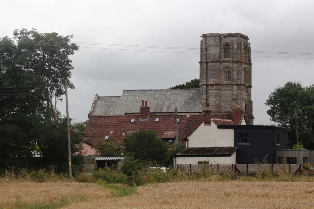 The Church of St George in Ruishton near Taunton, seen from the fields alongside the River Tone.